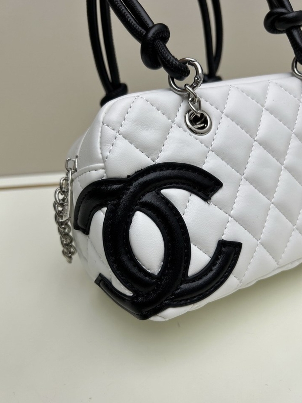 CHANEL White Quilted Leather Shoulder Bag with Black CC Emblem